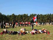 ... chases the few French survivors from the field